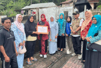 Penyerahan bantuan untuk korban kebakaran dari TP-PKK Padang Panjang.