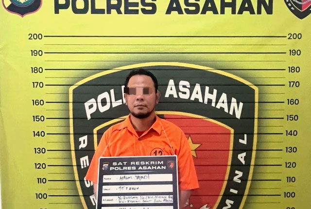 Potret tersangka HJ (45), yang menganiaya istrinya di Asahan, Kamis (9/10/2025).  Foto: Dok. Humas Polres Asahan