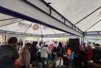 Area foto di tenda pendaftaran Kartu Layanan Gratis milik Dinas Perhubungan DKI Jakarta di area CFD, Bundaran HI, Jakarta Pusat pada Minggu (2/11/2025). Foto: Amira Nada Fauziyyah/kumparan
